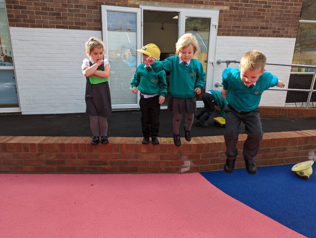 EYFS pupils are seen playing in and enjoying their new outdoor area on the academy grounds.