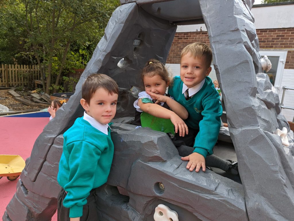 EYFS pupils are seen playing in and enjoying their new outdoor area on the academy grounds.
