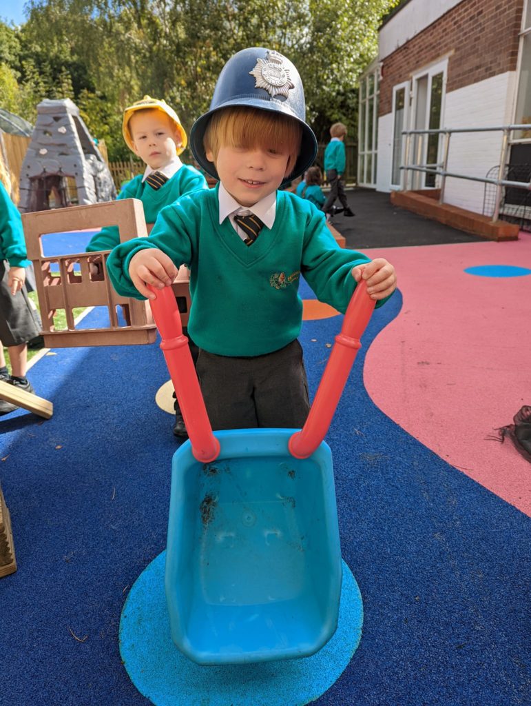 EYFS pupils are seen playing in and enjoying their new outdoor area on the academy grounds.