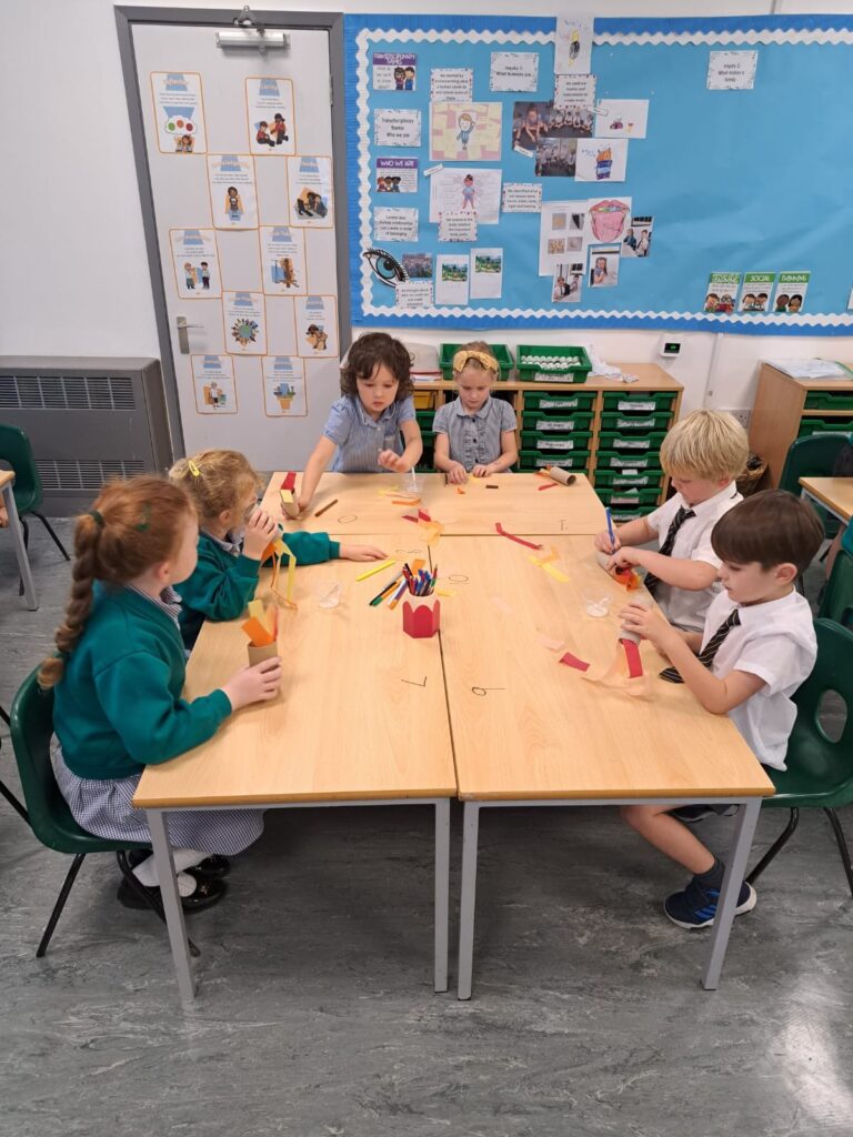Year 1 pupils are pictured making their own Rockets in order to bring their Maths lesson to life!