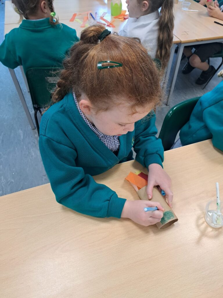 Year 1 pupils are pictured making their own Rockets in order to bring their Maths lesson to life!