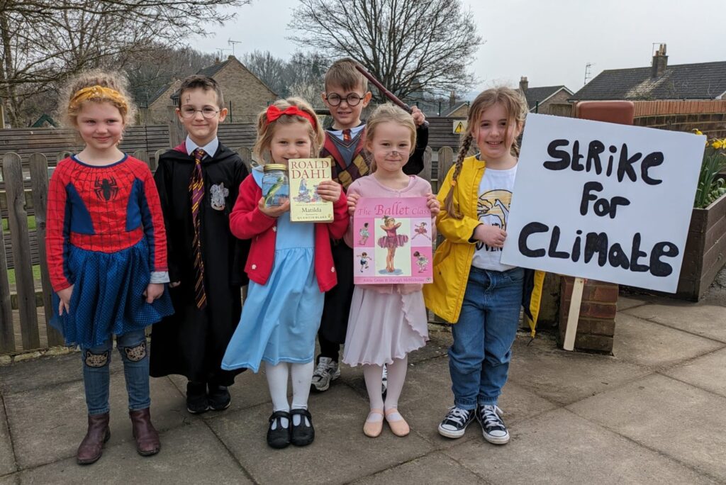 Students smiling for a photo in their World Book Day costumes