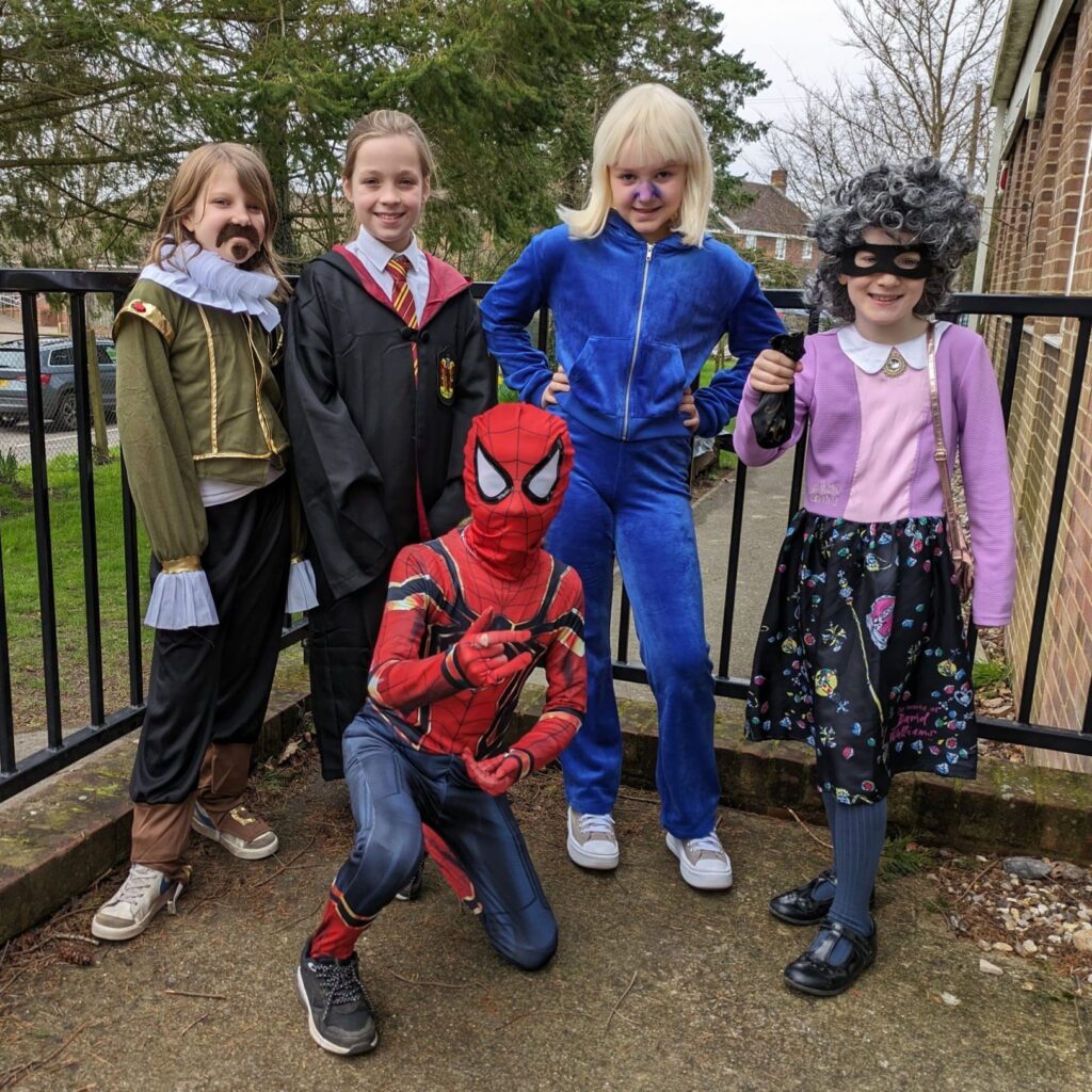 Five students are pictured dressed up as well-known characters from books for World Book Day 2024.