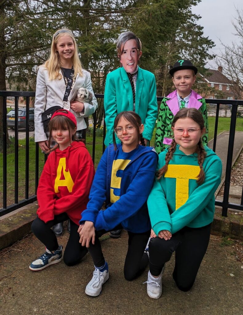 Six students are pictured dressed up as well-known characters from books for World Book Day 2024.